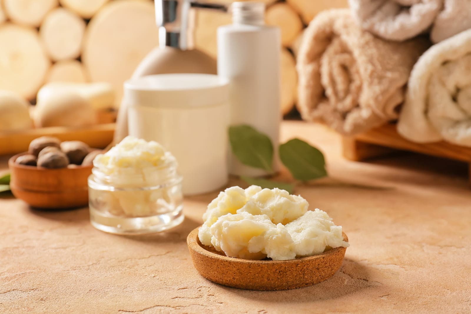 Shea butter in a warm spa setting with natural skincare ingredients.